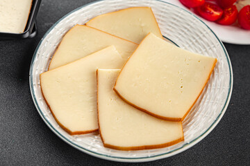 Raclette cheese tasty food dish fresh delicious gourmet food background on the table rustic food top view copy space top view