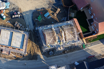Aerial view of UK house construction in the building industry, housing crisis, sustainable future