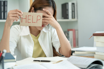 Asian student man have anxiety because of exams, male prepare for test and learning lessons in the library. stress, despair, haste, misunderstanding reading, discouraged, expectation, knowledge, tired