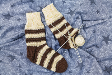 Knitted socks on a star background