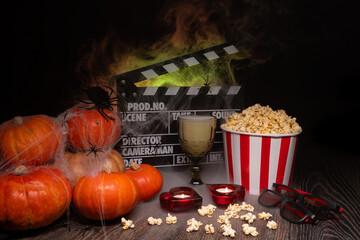 Cinema Theater Poster: Film Clapperboard, Watching Film Movie. Movie genre: horror, nightmares. Popcorn and Glasses from Cinema Theater. Halloween scene: Pumpkins, Mist, Fog, Smoke, Fire and Spiders