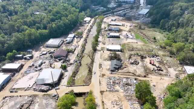 Aerial video of devastation of buildings and businesses along the Swannanoa River, 1 week after passage of tropical storm Helene, Asheville, NC.