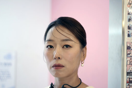 30s business woman posing as a business woman in studio