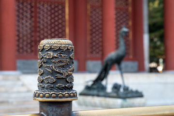 Intricate Dragon Post with Bronze Phoenix Silhouette, Symbol of Imperial China, Beijing, China,...