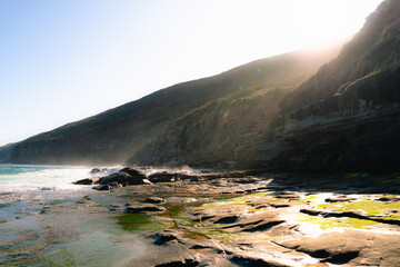 Lilyvale. Coastal View from Palm Jungle Loop Track, Royal National Park. Rugged Cliffs and Blue Ocean Waves Meeting the Rocky Shore. Burnings Palms Area, New South Wales,  Australia