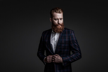 Obraz premium Bespoke suit. Bearded man in tailored formal menswear. Man businessman in bespoke formalwear. Business man in elegant tailored suit. Formal tailored suit. Gentleman menswear. Fashion sense