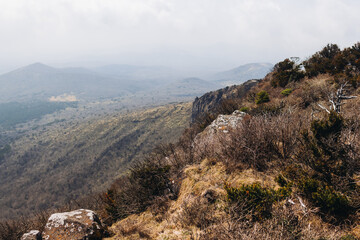 Hallasan National Park, Jeju island, South Korea, spring landscape view of Yeongsil trail, Halla volcano peak, trekking and climbing to Halla mountain, travel and hiking in Korea, Jeju-do, sunny day