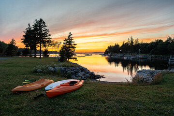 Small boats under the setting sun at Glen Margaret Bay, Nova Scotia
