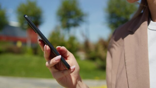 Beautiful young woman use phone with voice recognition ai speech audio message smartphone, business student in university campus making audio speech message.