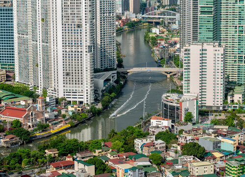 View of Metro Manila and Pasig River,from a high condo building,contrasting with dark clouds,Luzon,The Philippines.
