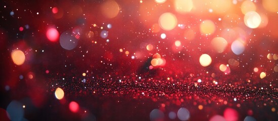 Abstract red bokeh background with sparkling lights.