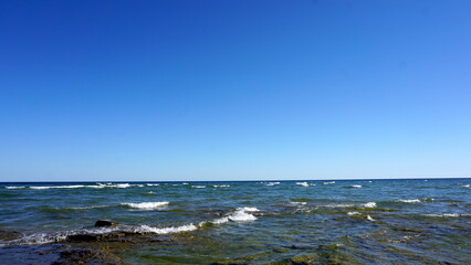 Blue Waves Crashing on Rocky Shoreline in Door County