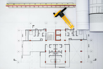 Construction and architectural drawings. Technical blueprints and measuring tools for building projects. Top view