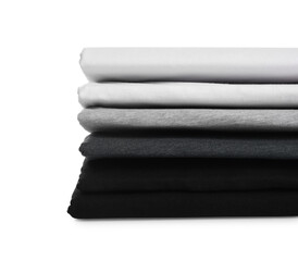 Stack of clean colorful t-shirts isolated on white