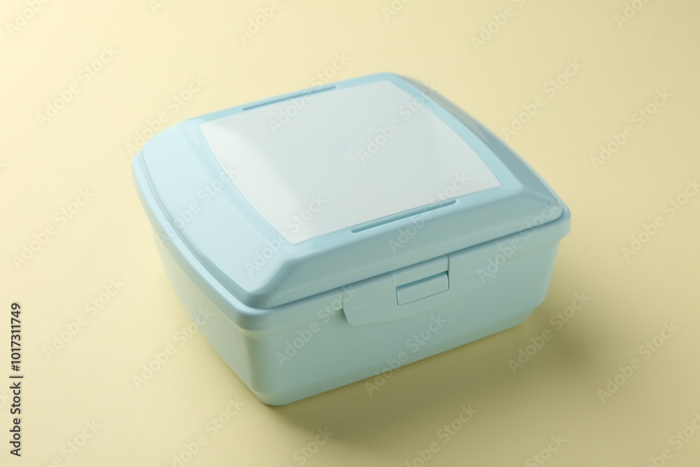 Sticker One light blue lunch box on beige background