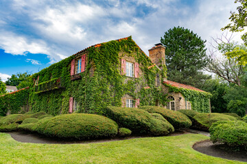 Suburb exterior with private housing. Suburban neighborhood. Private family home architecture. House exterior. Private house in suburban area. Suburban house architecture. Real estate market