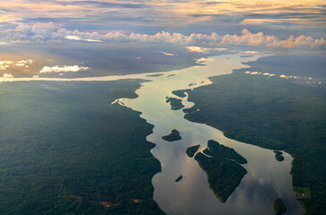 The Essequibo and Cuyuni rivers in the Amazon rainforest of Guyana at sunset. South America
