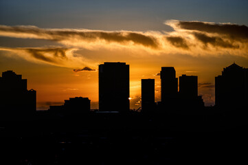 Urban Sunset or Sunrise with Orange and Yellow Clouds and Sky.