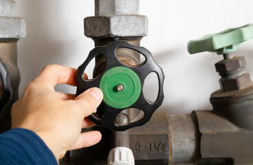 Plumber using backflow shut off valve or backwater valve. Emergency water shut-off preventing...