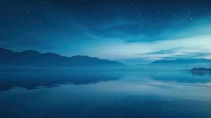 Fototapeta premium A quiet ocean bay at night, reflecting the deep blue hues of the sky and distant stars, creating a tranquil and expansive feeling as sky and water merge