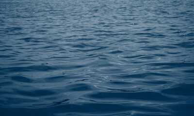 Fototapeta premium Close-up of nature pattern, season and holiday. Concept of blue water and soft waves. Ocean flow background.