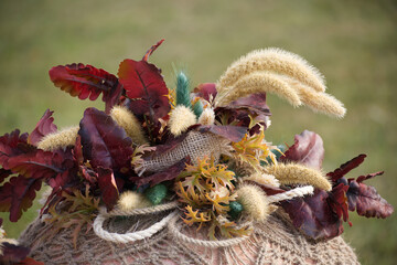 Rustic autumn bouquet with burlap and leaves