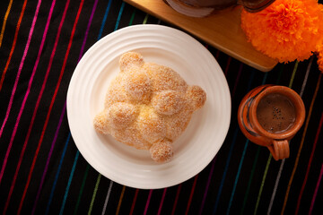 Pan de Muerto. Typical Mexican sweet bread that is consumed in the season of the day of the dead. It is a main element in the altars and offerings in the festivity of the day of the dead.