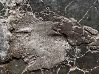 photo of the floor is dark and has many cracks