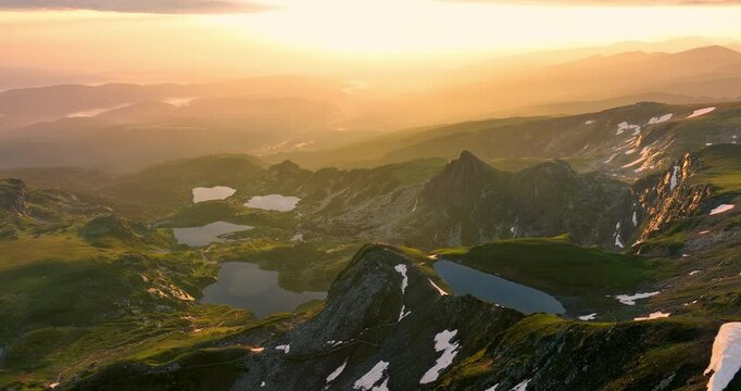 Bulgarian mountains and Seven Rila lakes sunrise aerial panorama, beautiful nature for tourism, hiking, trekking in Bulgaria spectacular video