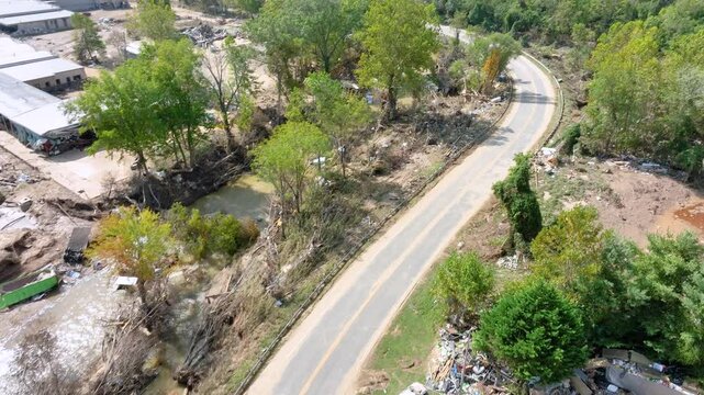 Aerial video, 1 week after the damage from tropical storm Helene along the Swannanoa River, near Asheville, NC.