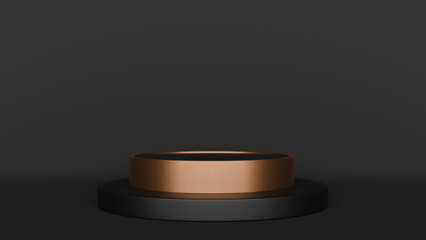 a black and gold ring on a black surface