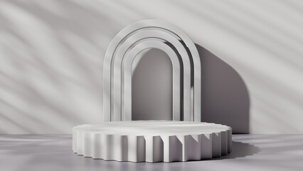 a white arch with a shadow on a wall