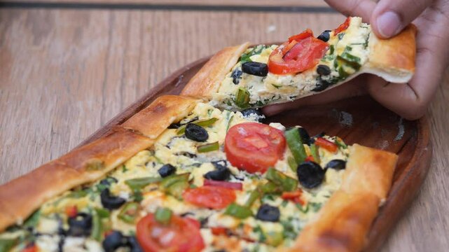 Turkish pide traditional food with beef and vegetables.
