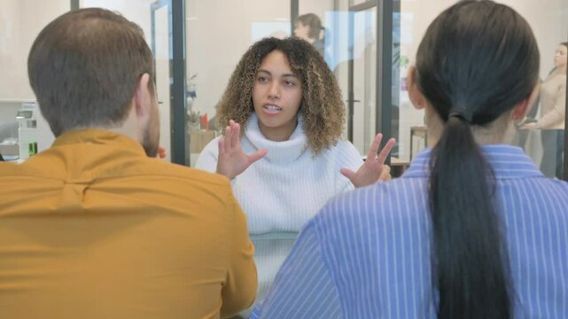 Angry African Woman Talking with Mixed Race Colleagues