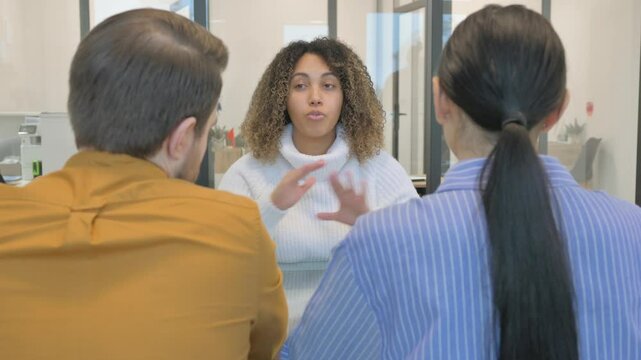 African Therapist Talking with Mixed Race Couple