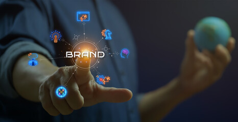 Businessman shows glowing neon line of BRAND concept with icons of innovation, advertising,...