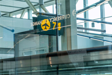 Vancouver, British Columbia, Canada – October 1, 2024: Passengers walk to their gate at Vancouver International Airport in Vancouver, BC, Canada.