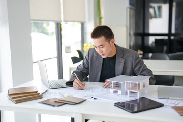 Obraz premium Architecture Man drawing on architectural Creative project business architecture building construction&nbsp;Industrial engineering Achievement Planning Design on eco blueprint