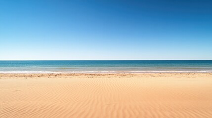 Serene Beach with Clear Blue Sky and Calm Waters
