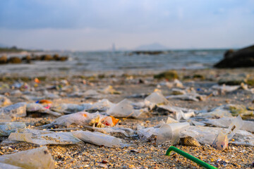 Top view trash, plastic cups and plastic bags at the beach. environmental problem concept and healing the world	
