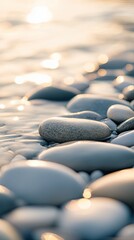 Fototapeta premium A serene close-up of smooth pebbles along a tranquil shoreline, glistening in soft natural light, creating a calming atmosphere.