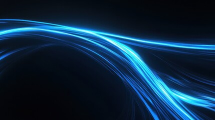 Fototapeta premium A dynamic abstract image featuring flowing blue light trails on a dark background.