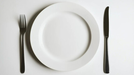 A clean white plate with fork and knife on either side, set against a minimalist white background.
