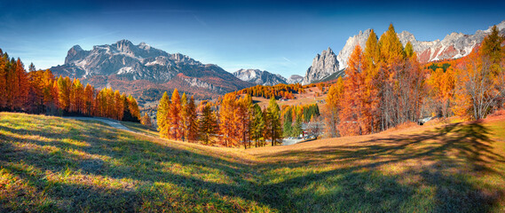 Panoramic autumn view of countryside outskirts of Cortina d'Ampezzo town. Great morning scene of...