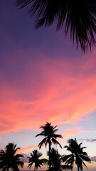 Obraz premium A tropical sunset sky with orange and pink hues reflecting off the ocean, with palm trees silhouetted in the foreground swaying gently in the breeze 