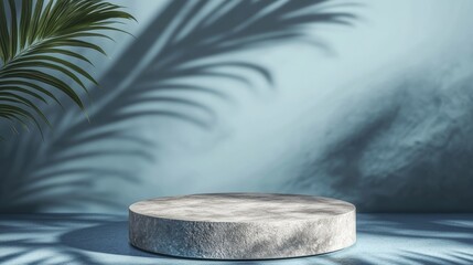 Empty podium made of gray stone on a blue background with a shadow of tropical leaves scene for the promotion of products beauty natural eco-cosmetics showcase display case