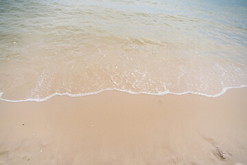 Gentle Waves on Sandy Shore
