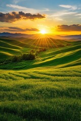 Fototapeta premium A breathtaking sunset over rolling green hills, showcasing vibrant colors and serene beauty in nature's landscape.