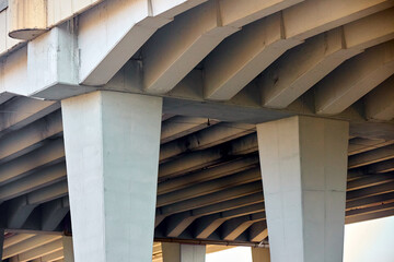 Reinforced Concrete Structure of Highway Overpass. View From Bottom Down. Concrete beams under the...