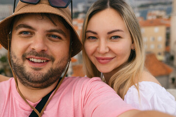 Young Couple Taking Selfies In Old Alley In Budva